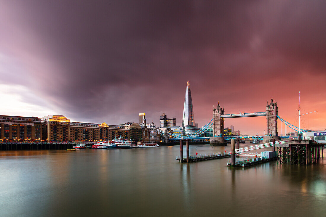 Tower Bridge and The Shard at sunset with storm clouds, London, England, United Kingdom, Europe