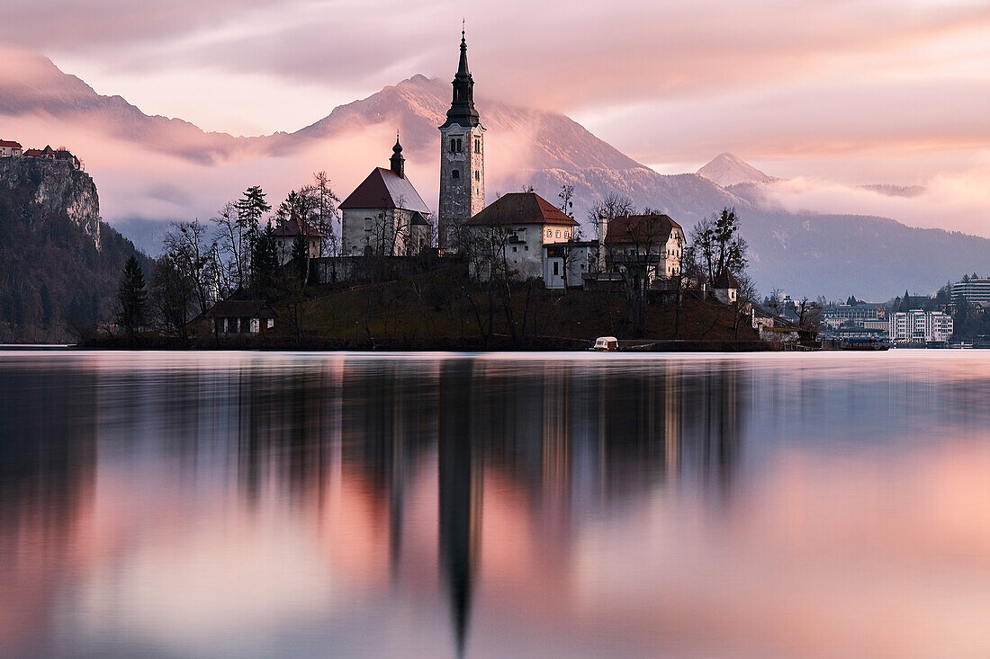 A church in the island in the middle of Bled lake at sunrise, Slovenia, Europe