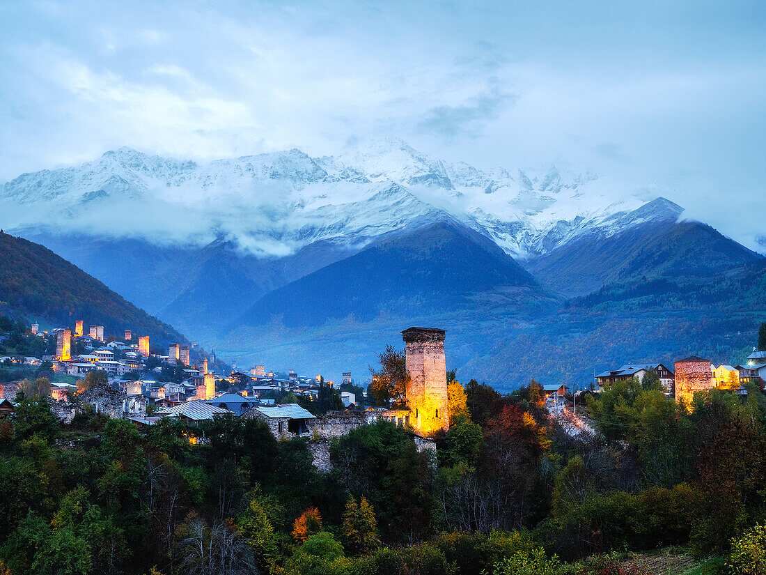 View of the typical Svaneti towers at blue hour in Mestia, Samegrelo-Upper Svaneti, Georgia (Sakartvelo), Central Asia, Asia