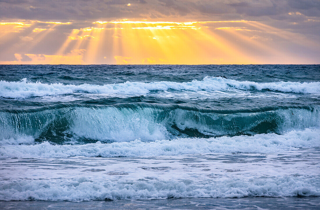 Sea waves at sunrise