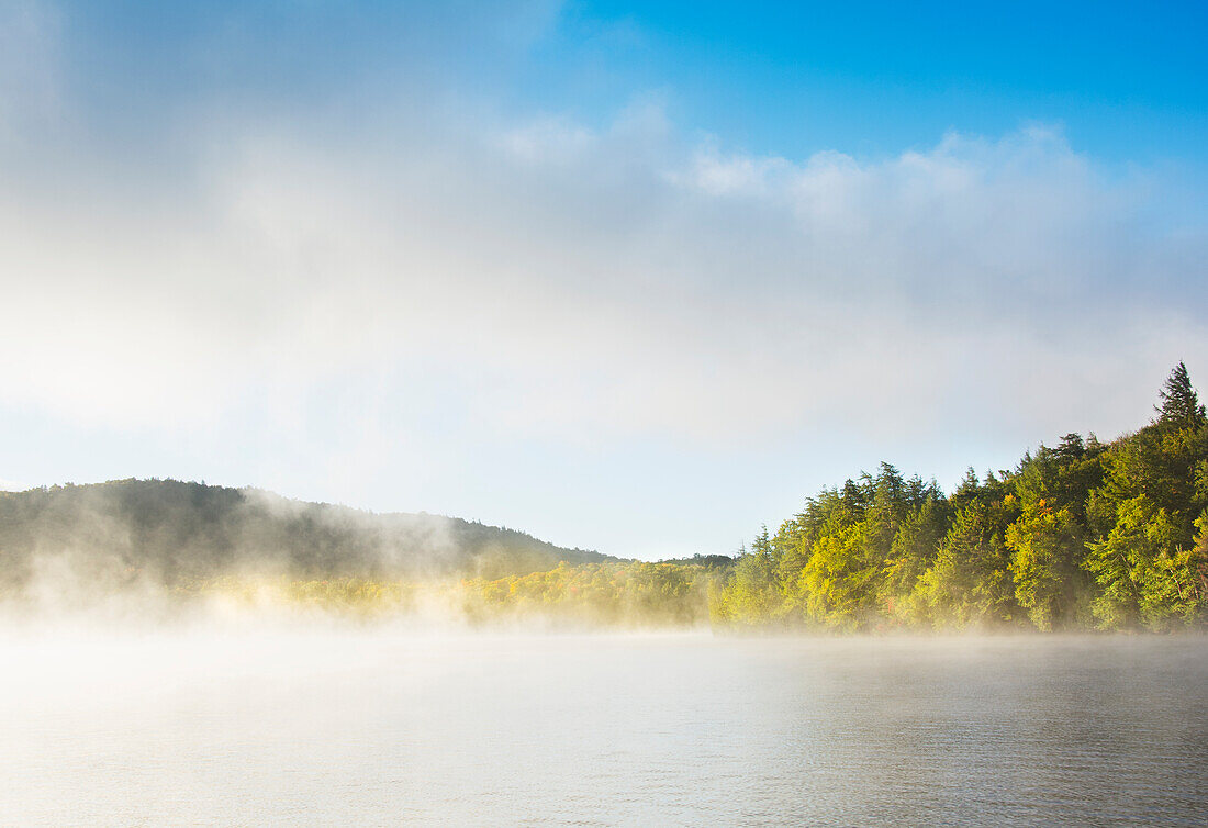 Usa, New York State, North Elba, Morning fog over Placid Lake