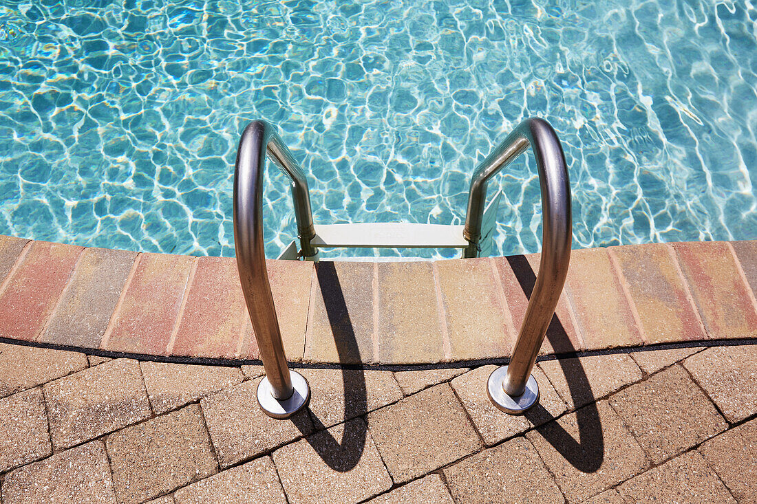 Ladder on swimming pool edge