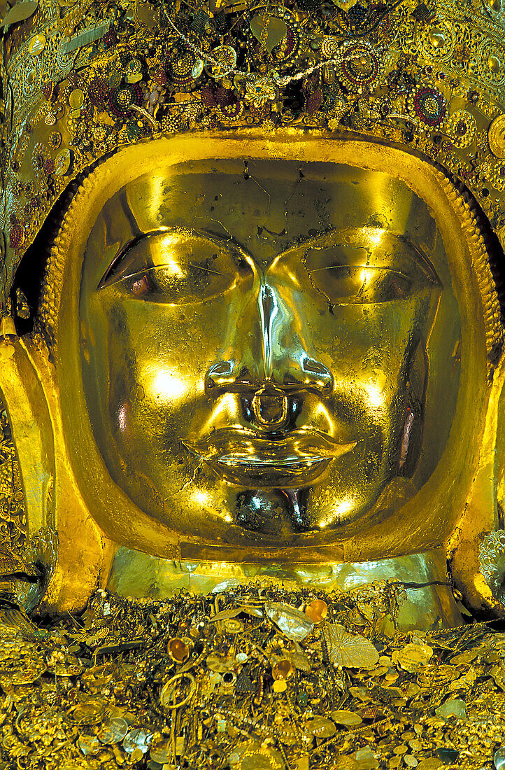 Myanmar, Mandalay, Giant golden buddha statue in Buddhist temple