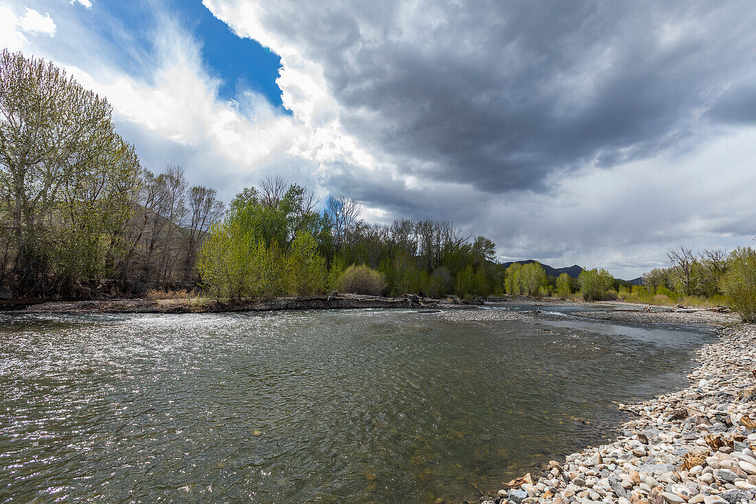 USA, Idaho, Bellevue, Clouds above Big Wood River in spring near Sun Valley