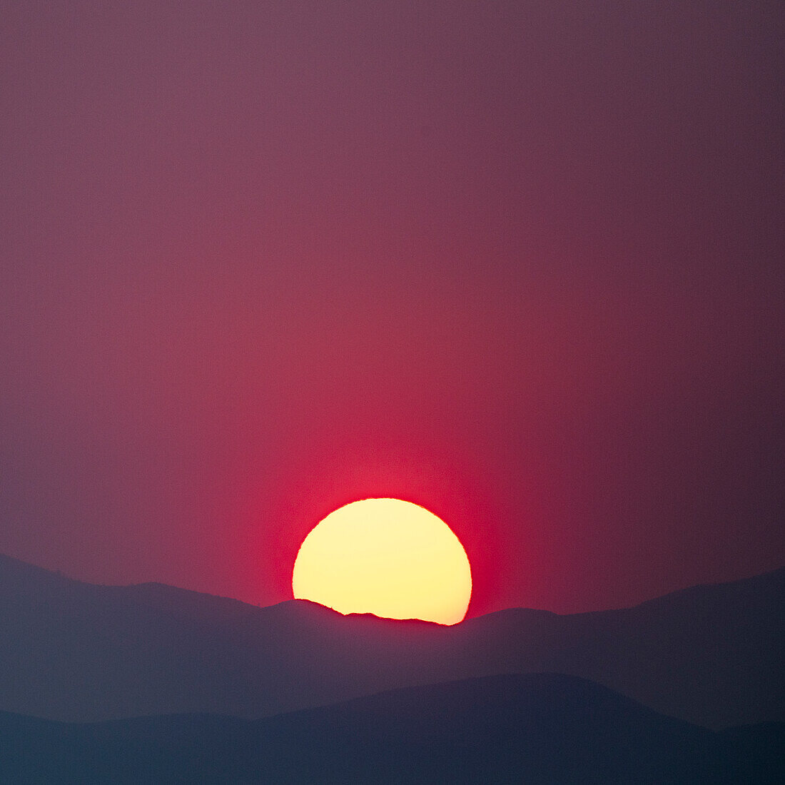 USA, Idaho, Bellevue, Sun setting behind hills