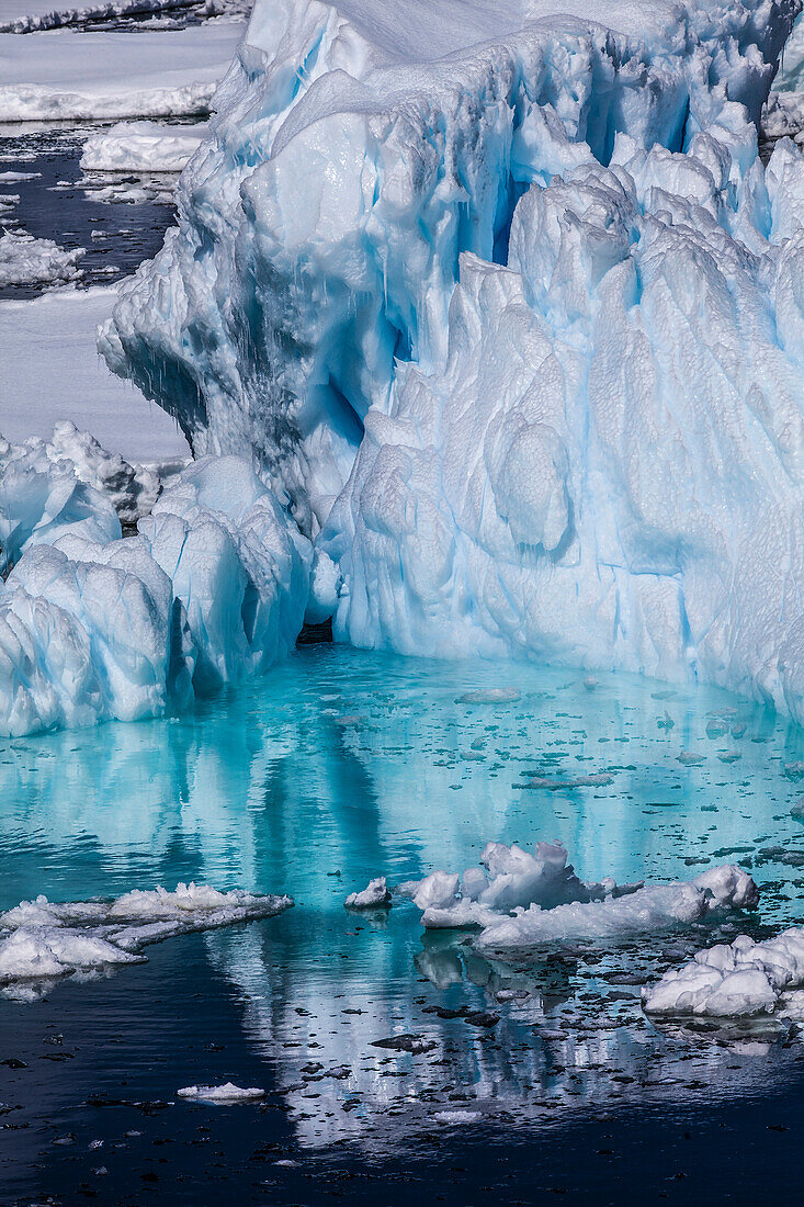 Antarctica. Colorful Iceberg and Sea Ice