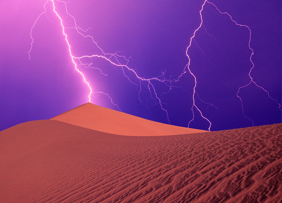 California, Death Valley National Park, Digital composite of lightning bolts striking sand dunes