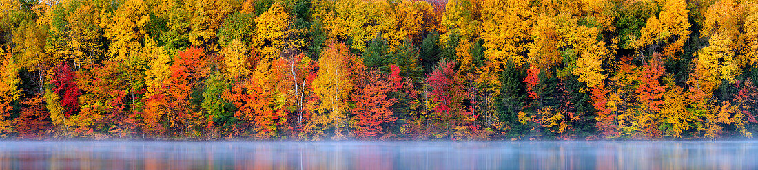 USA, Michigan, Upper Peninsula, Panorama of autumn fog and reflections on Moccasin Lake
