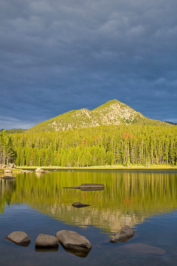Minneopa Lake catches dramatic morning light in the Pioneer Mountains near Dillon Montana