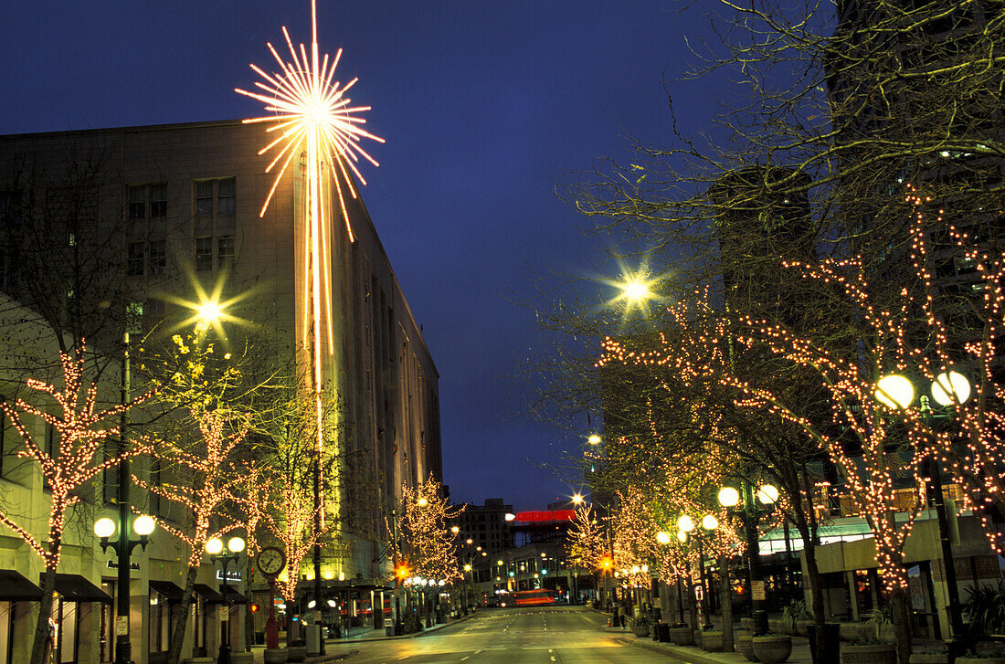 USA, Washington State, Seattle, Fourth Avenue at night during holiday season, winter.
