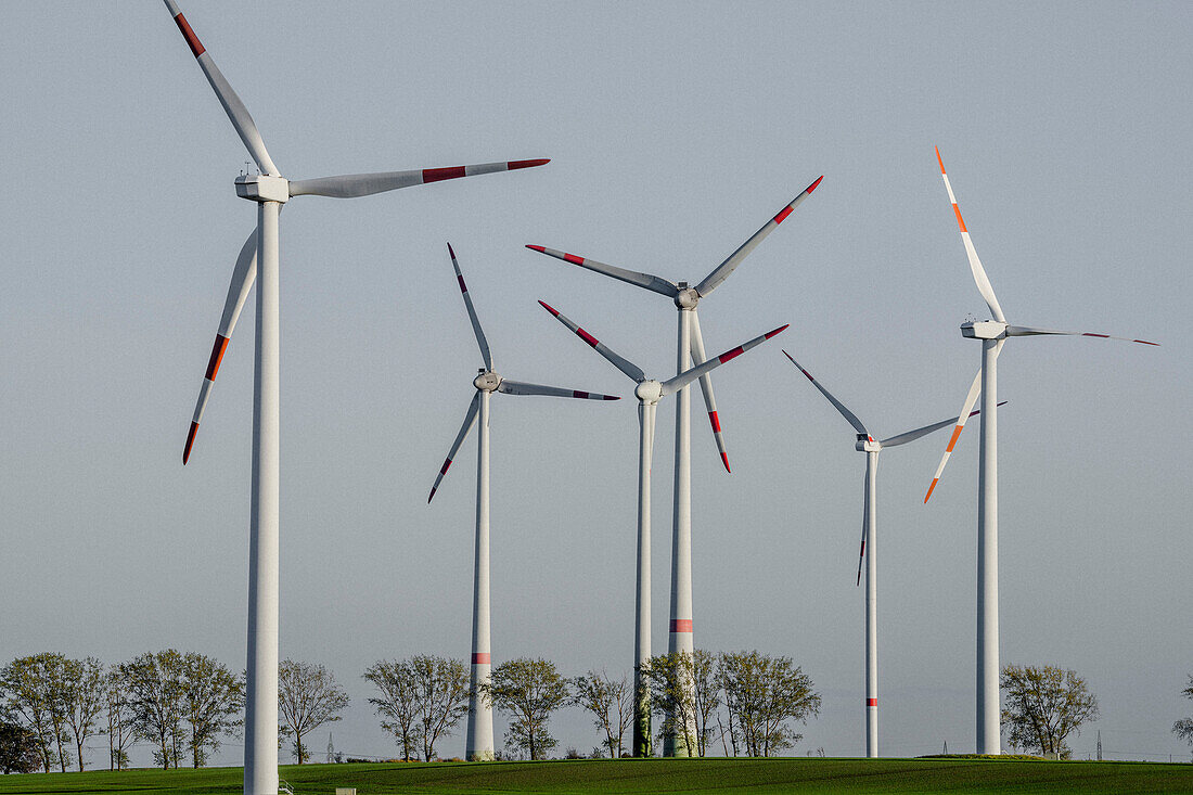 Wind turbine farms against sunny blue sky, Germany
