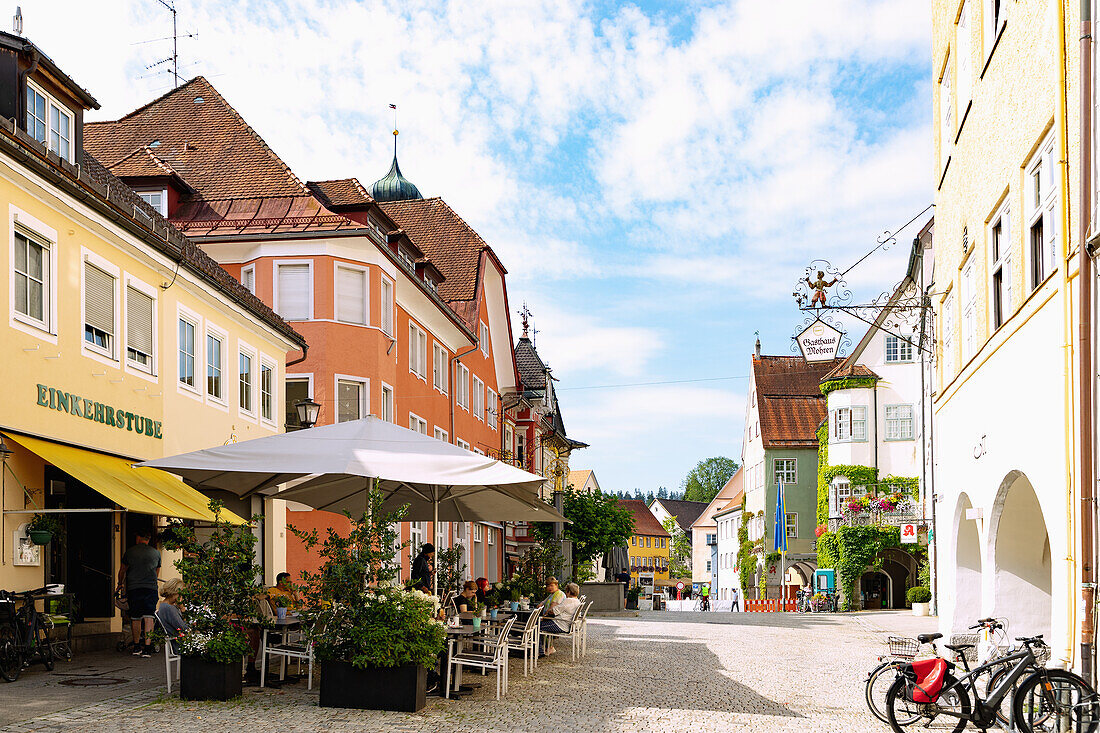 Wassertorstraße with street cafes and town hall Isny in the Westallgäu in Baden-Württemberg in Germany