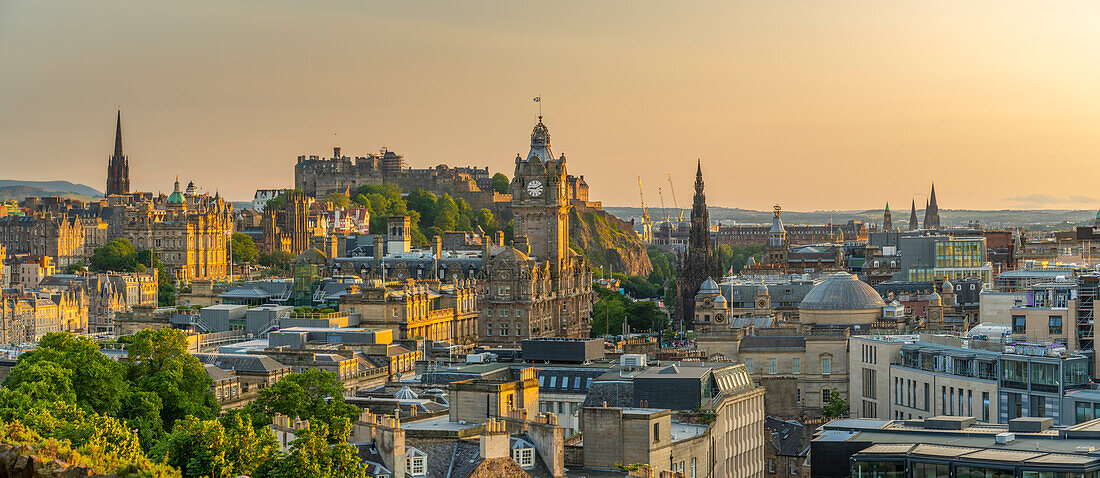 View of Edinburgh Castle, Balmoral Hotel and city skyline from Calton Hill at golden hour, Edinburgh, Lothian, Scotland, United Kingdom, Europe