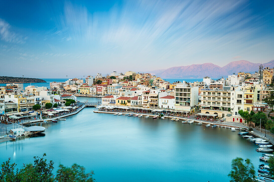 Seaside town resort of Agios Nikolaos by lake Voulismeni, Lasithi prefecture, Crete, Greek Islands, Greece, Europe