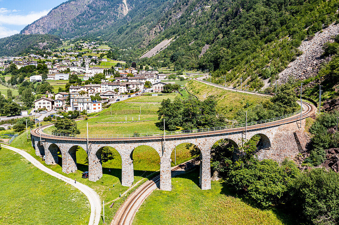 Aerial of the Brusio spiral viaduct, UNESCO World Heritage Site, Rhaetian Railway, Switzerland, Europe