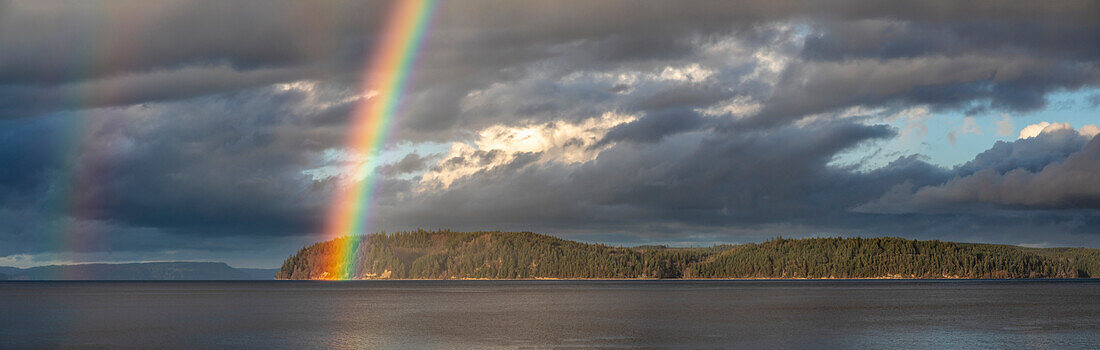 USA, Washington State, Seabeck. Panoramic of rainbow over Hood Canal
