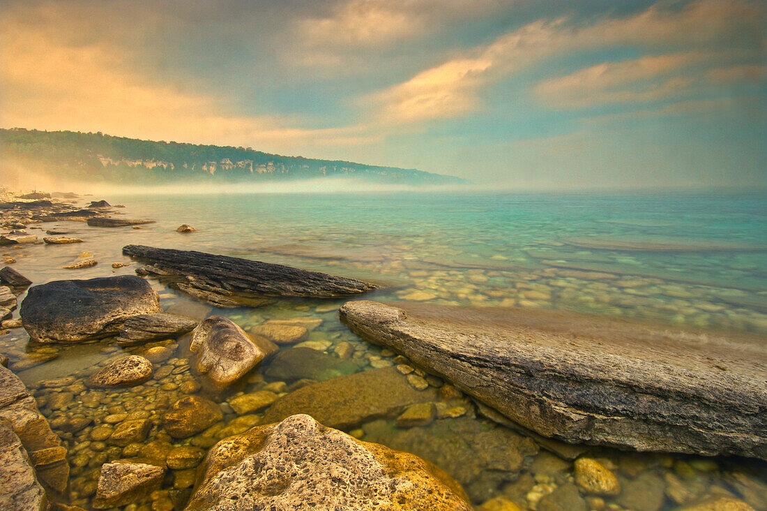 Canada, Ontario, Morning fog on Georgian Bay. Limestone Rock. Barrow Bay. Bruce Peninsula.