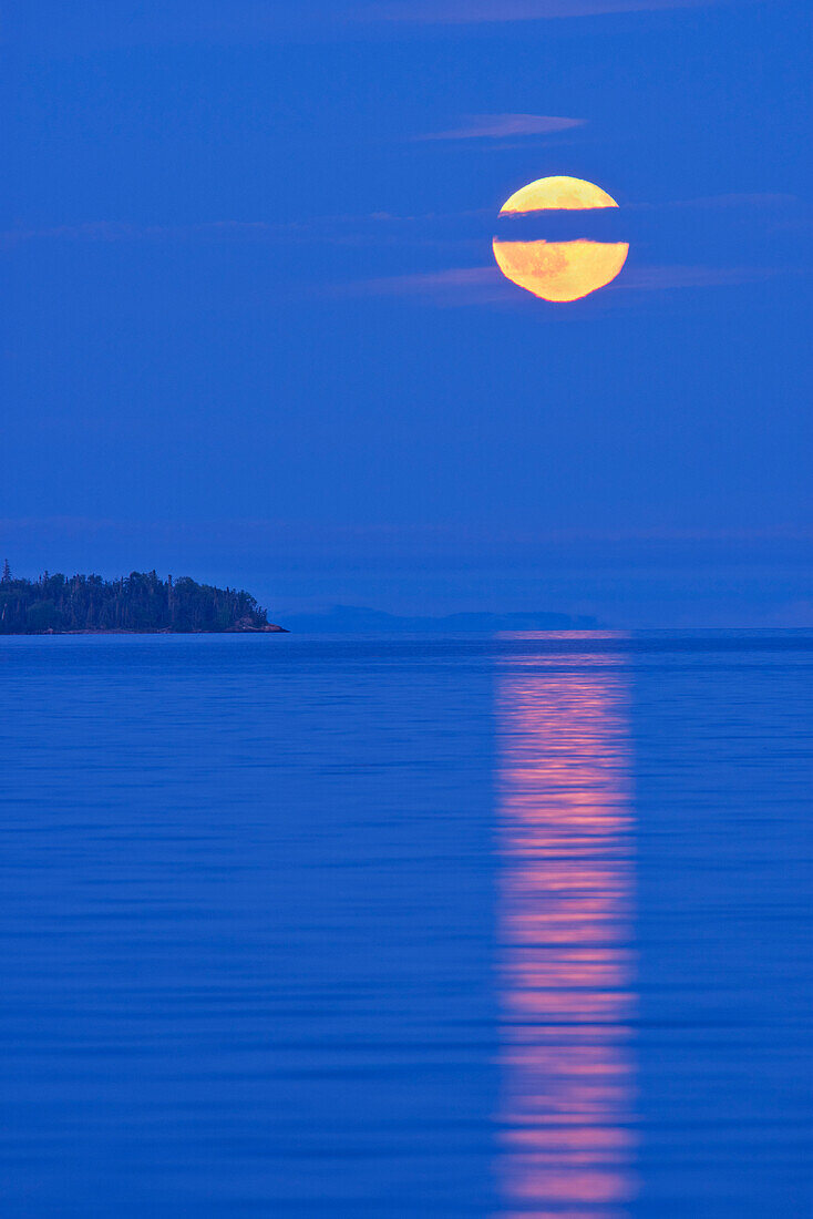 Canada, Ontario, Rossport. Full moon rising over Lake Superior.