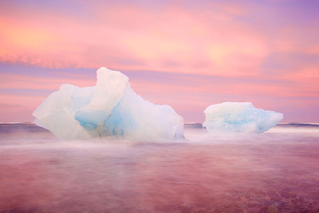 Europe, Iceland, Jokulsarlon Glacier Lagoon. Sunset on beached icebergs.