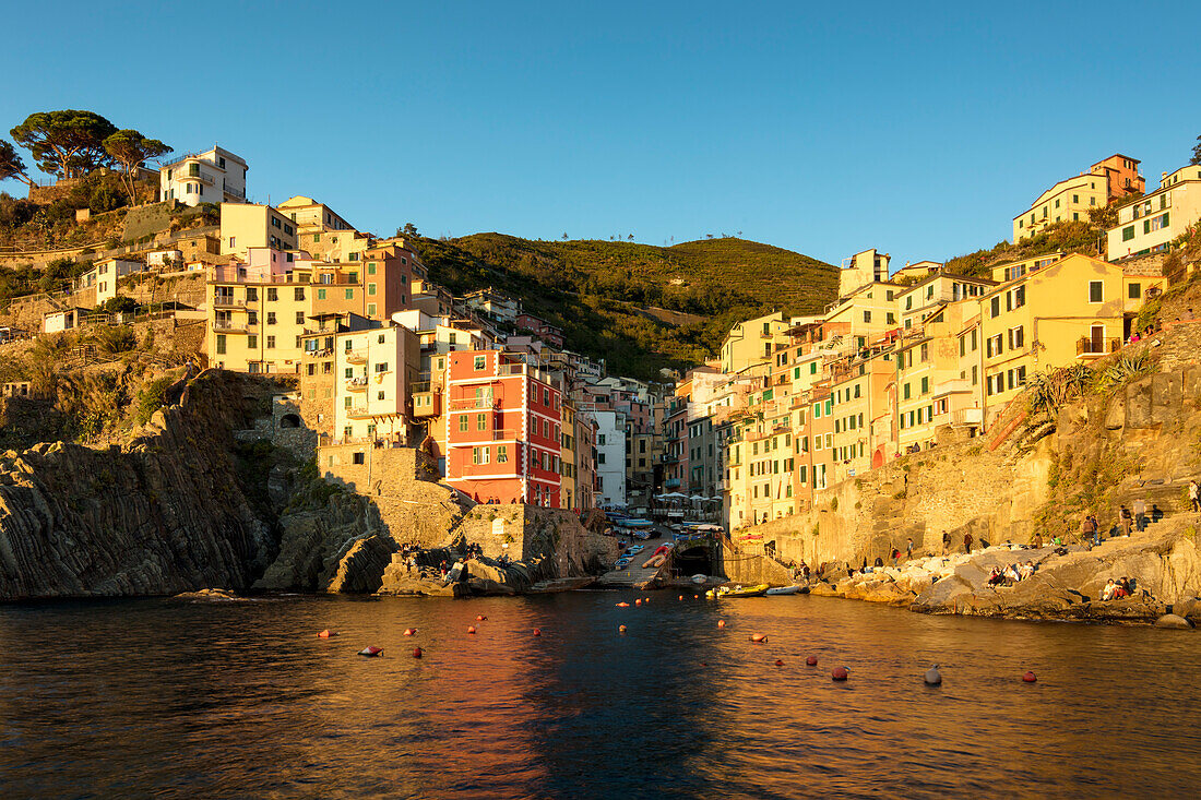 Setting sunlight on the town of Riomaggiore - one of the Cinque Terre, Liguria, Italy
