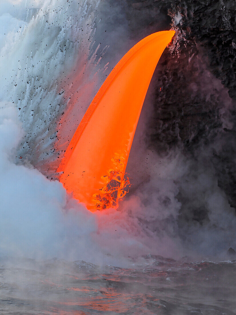 USA, Hawaii, Big Island. Lava from the Big Island's Pu'u O'o eruption flowing into the ocean on the Kalapana coast, Hawaii Volcanoes National Park.