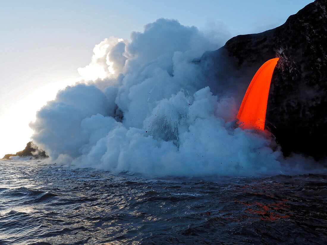 USA, Hawaii, Big Island. Lava from the Big Island's Pu'u O'o eruption flowing into the ocean on the Kalapana coast, Hawaii Volcanoes National Park.