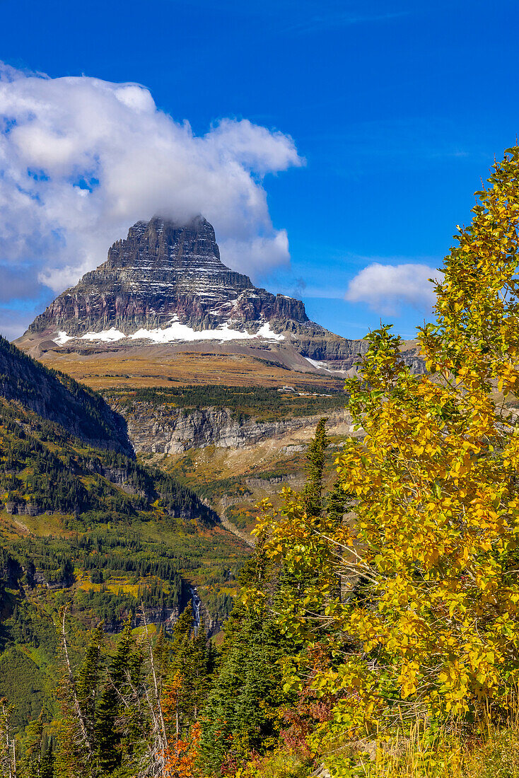 Clements Mountain and Reynolds Creek Falls in autumn, Glacier National Park, Montana, USA