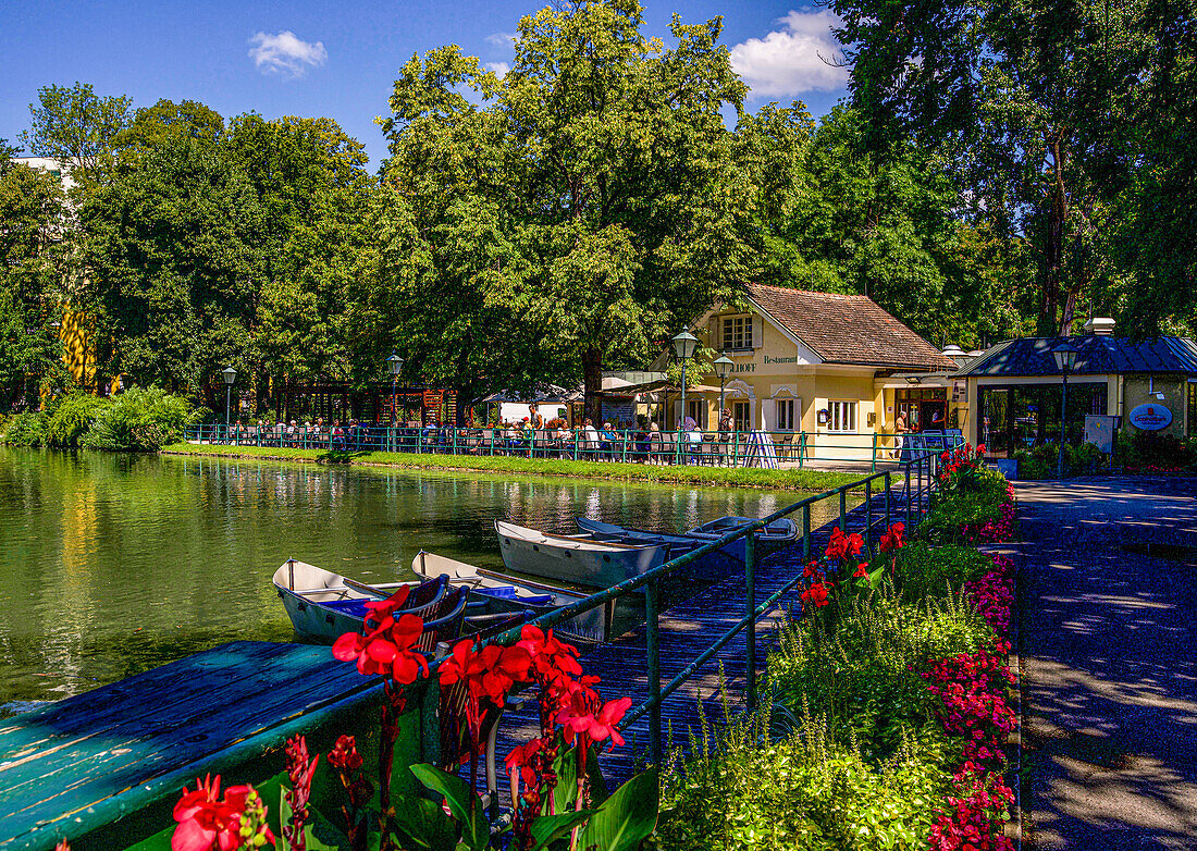 Pond with rowing boats and restaurant in Doblhoffpark, Baden near Vienna, Lower Austria; Austria