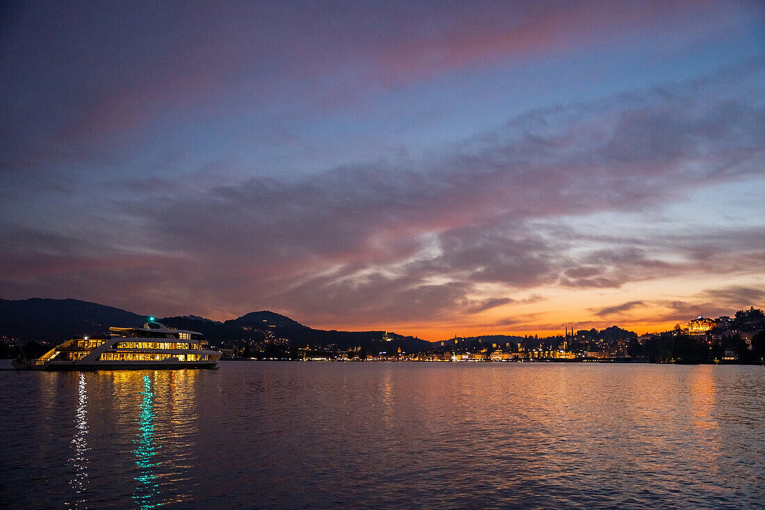 Illuminated passenger ship on Lake Lucerne