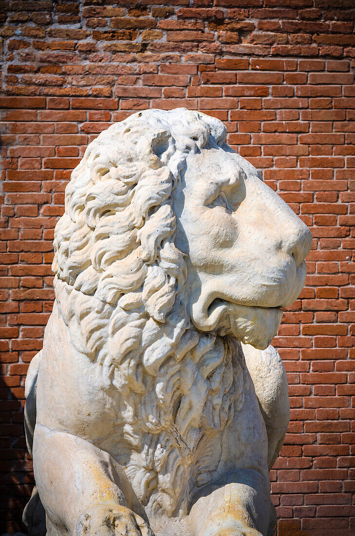 Lion statue at the entrance to the Arsenal, Venice, Veneto, Italy