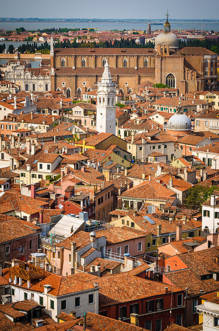 Tile roof tops and leaning bell tower of Santa Maria Formosa church from the Campanile San Marco, Venice, Veneto, Italy