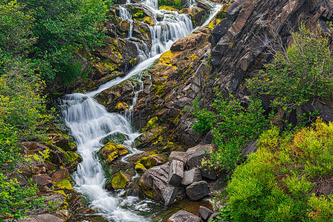 Canada, New Brunswick. River waterfall and rocky rapids.