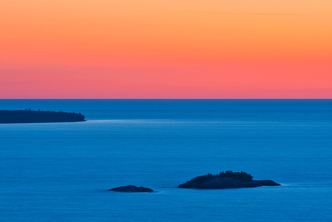 Canada, Ontario, Lake Superior Provincial Park. Islands in Lake Superior at sunset.
