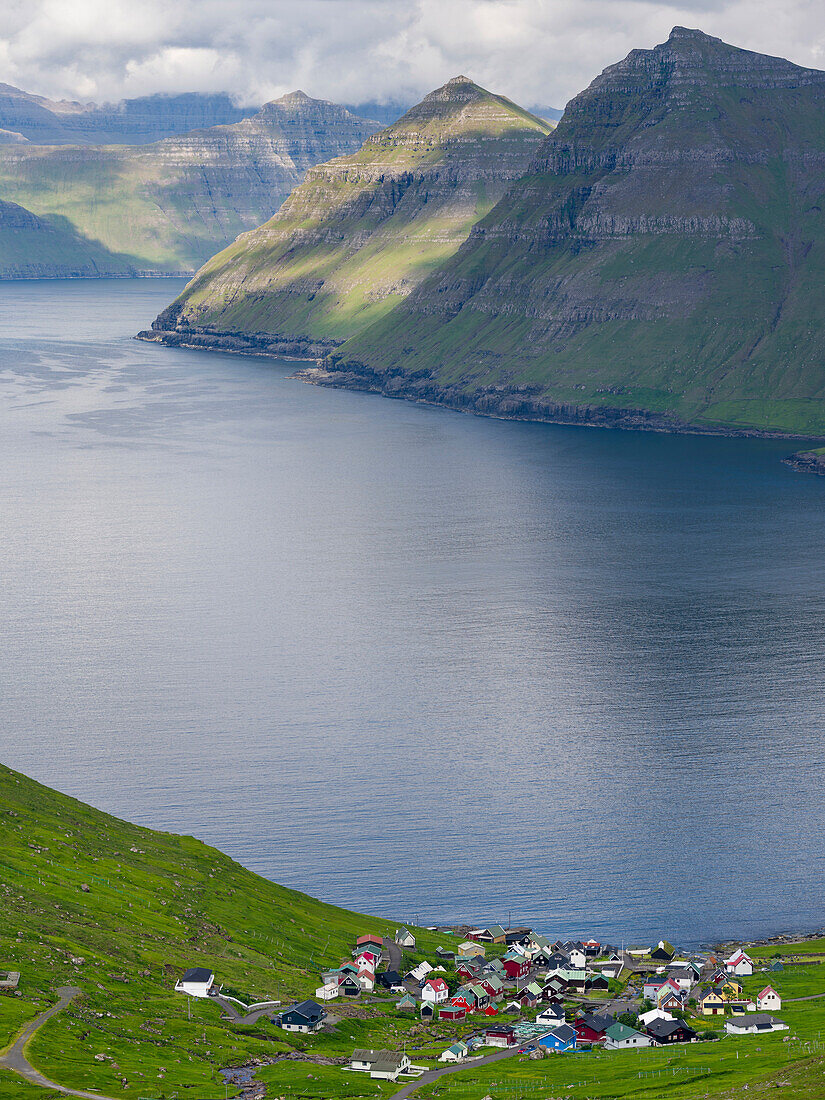 Village of Funningur, in the background Funningsfjordur, Leiriksfjordur and the island Kalsoy. Northern Europe, Denmark