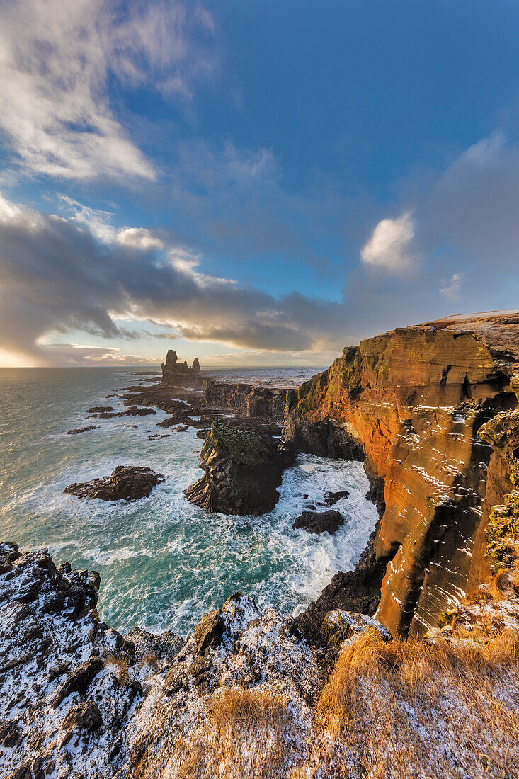 Dramatic cliffs at Londrangar sea stacks in the North Atlantic ocean on the Snaefellsnes peninsula in western Iceland