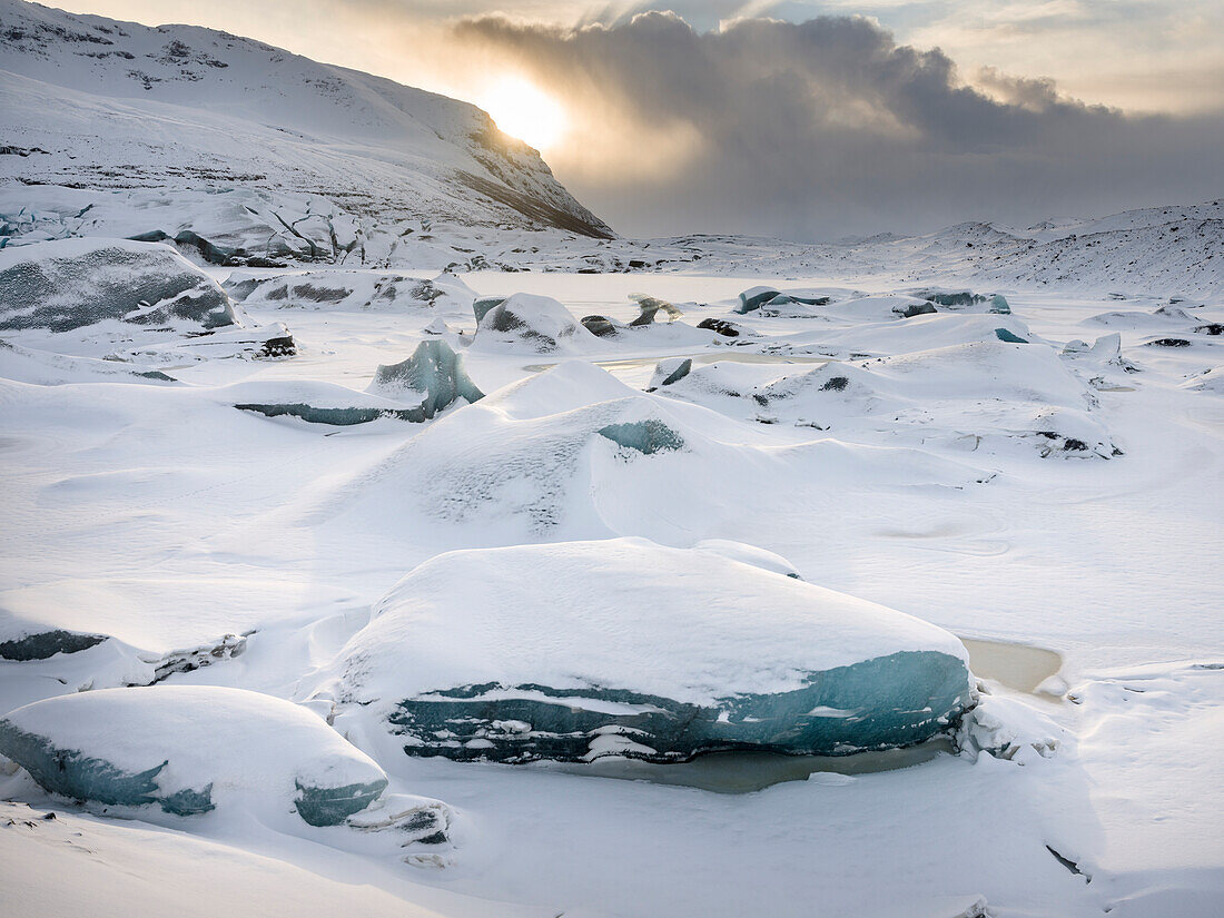 Glacier Svinafellsjoekull in the Vatnajokull National Park during winter. The glacier front and the frozen glacial lake. Iceland
