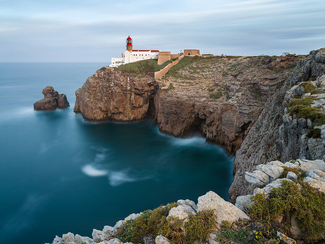 Cabo de Sao Vincente (Cape St. Vincent) with its lighthouse at the rocky coast of the Algarve in Portugal.