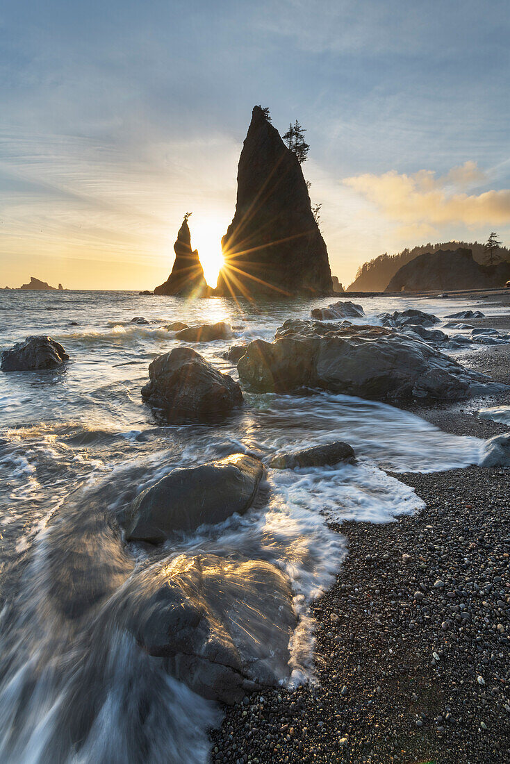 Setting sun behind Split Rock on Rialto Beach, Olympic National Park