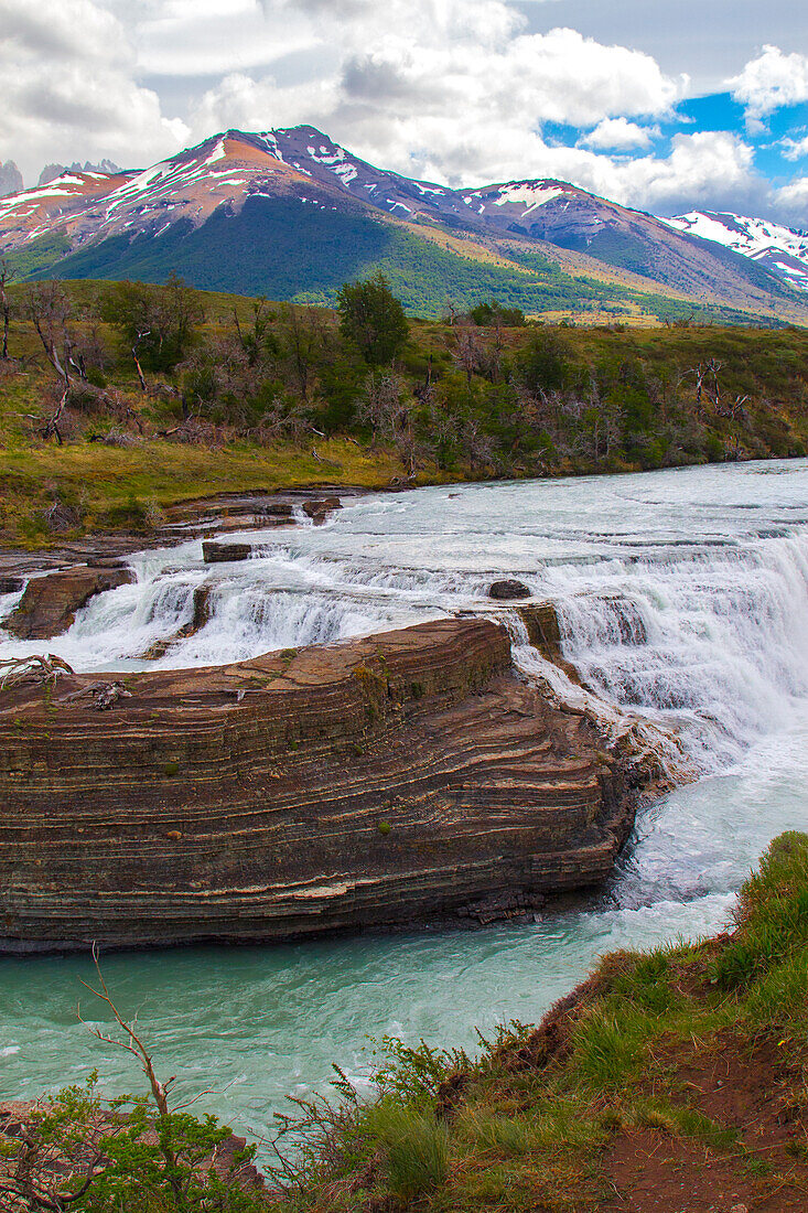 Located with Parc Nacional Torres del Paine, this lake has a runoff through rocks creating rapids.