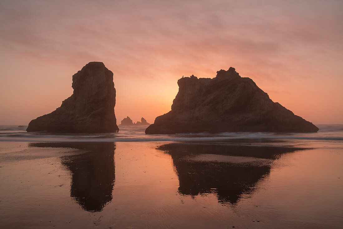 USA, Oregon, Bandon Beach. Sea stacks silhouetted at sunset
