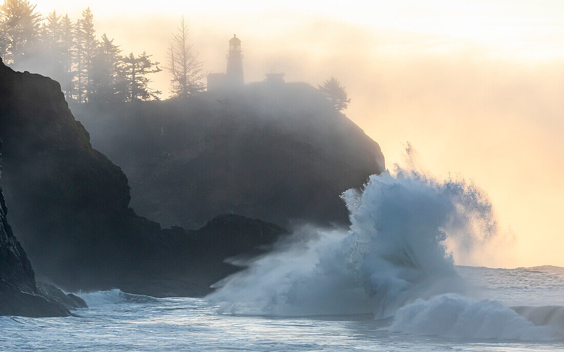 Washington State, Lighthouse and king tide surf, Cape Disappointment State Park.