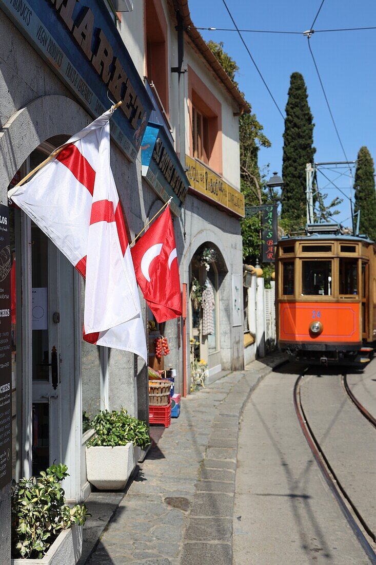 Historic tram and flags for the Sa Fira festival in Soller, Mallorca, Spain