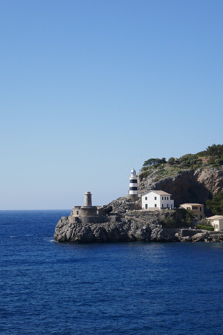 View to the lighthouse at Port de Soller harbour, Mallorca, Spain