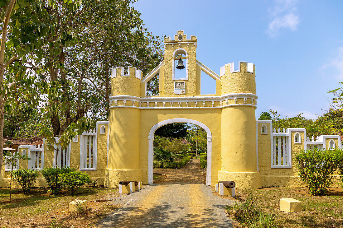 historic entrance gate of the Roça Belo Monte Hotel on the island of Principé in West Africa