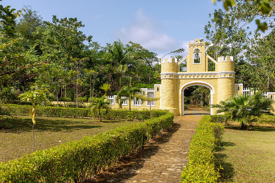 historic entrance gate of the Roça Belo Monte Hotel on the island of Principé in West Africa