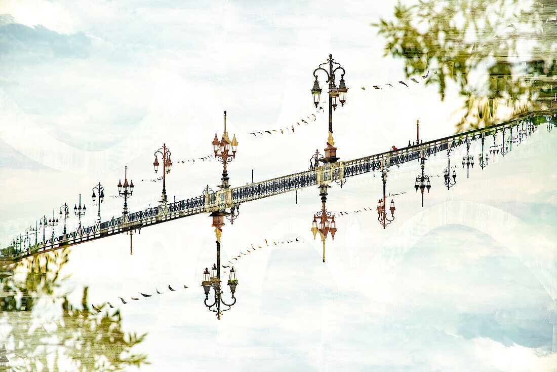 The elegant Pont de Pierre bridge, comissioned by Napoleon Bonaparte, crossing the river Garonne in Bordeaux, Fance.
