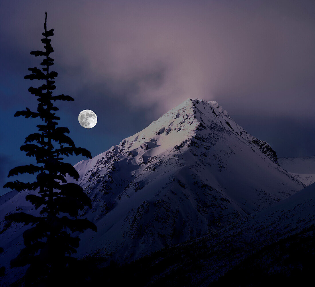 Moonrise over the Canadian Rocky Mountains in Jasper National Park, Alberta, Canada