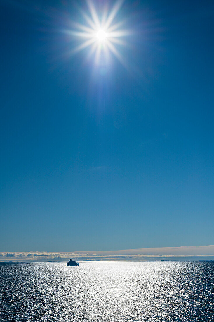 Backlit iceberg in Disko Bay, Baffin Bay, Ilulissat, Greenland