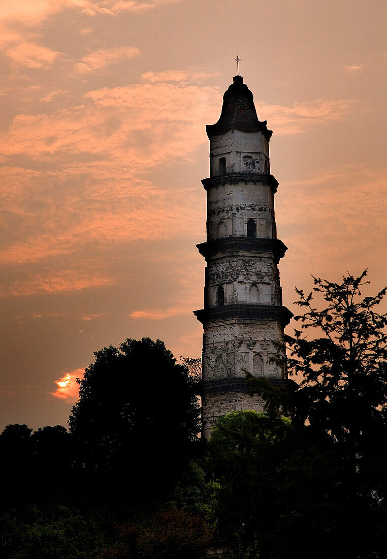 Great Mercy Pagoda, Shaoxing, Zhejiang Province, China, Sunrise in orange pink sky. Ancient Pagoda built 1,000 years ago,