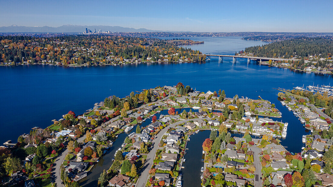 USA, Washington State, Bellevue. Newport Shores neighborhood, Lake Washington and SR520 floating bridge in autumn, with Seattle in distance.